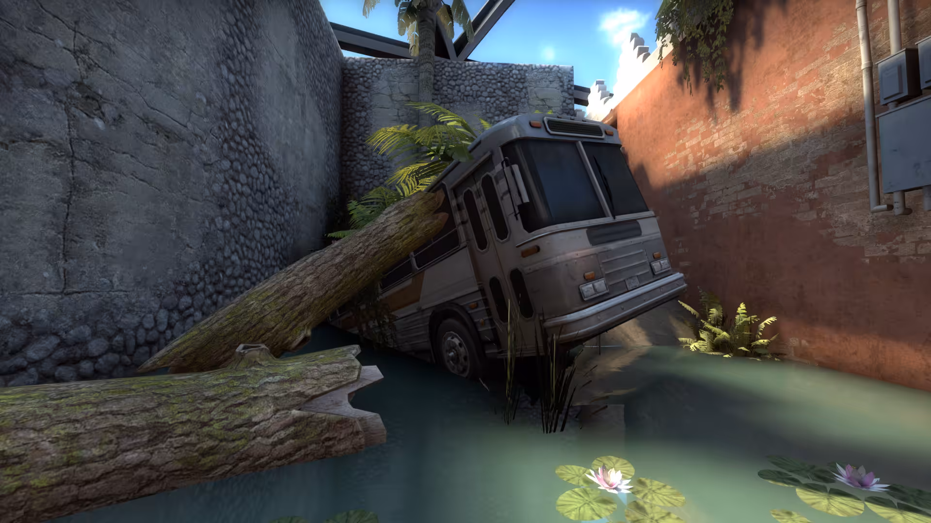 An overgrown bus between logs surrounded by water.