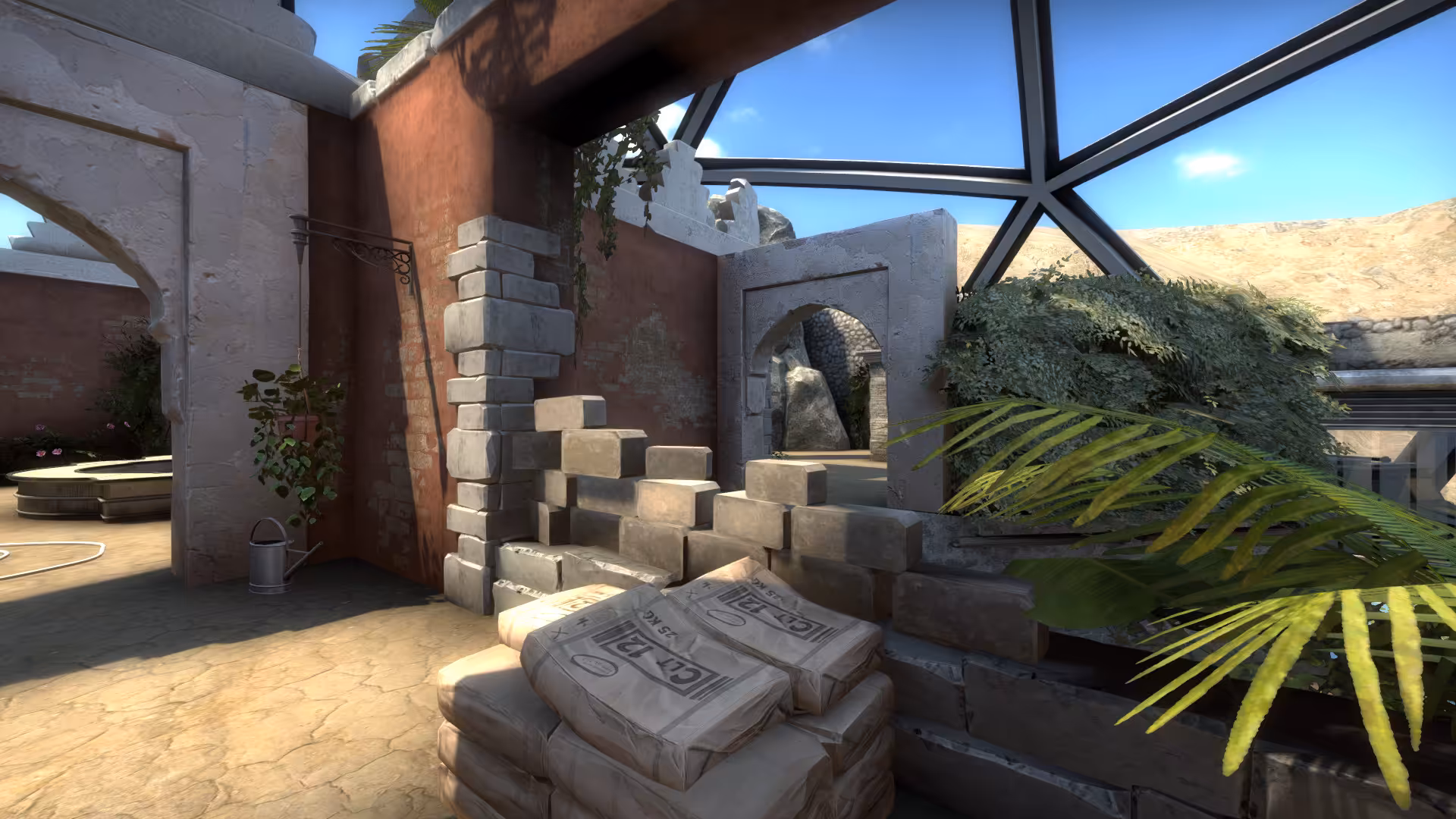 Stacks of cement bags and a knee-high wall.