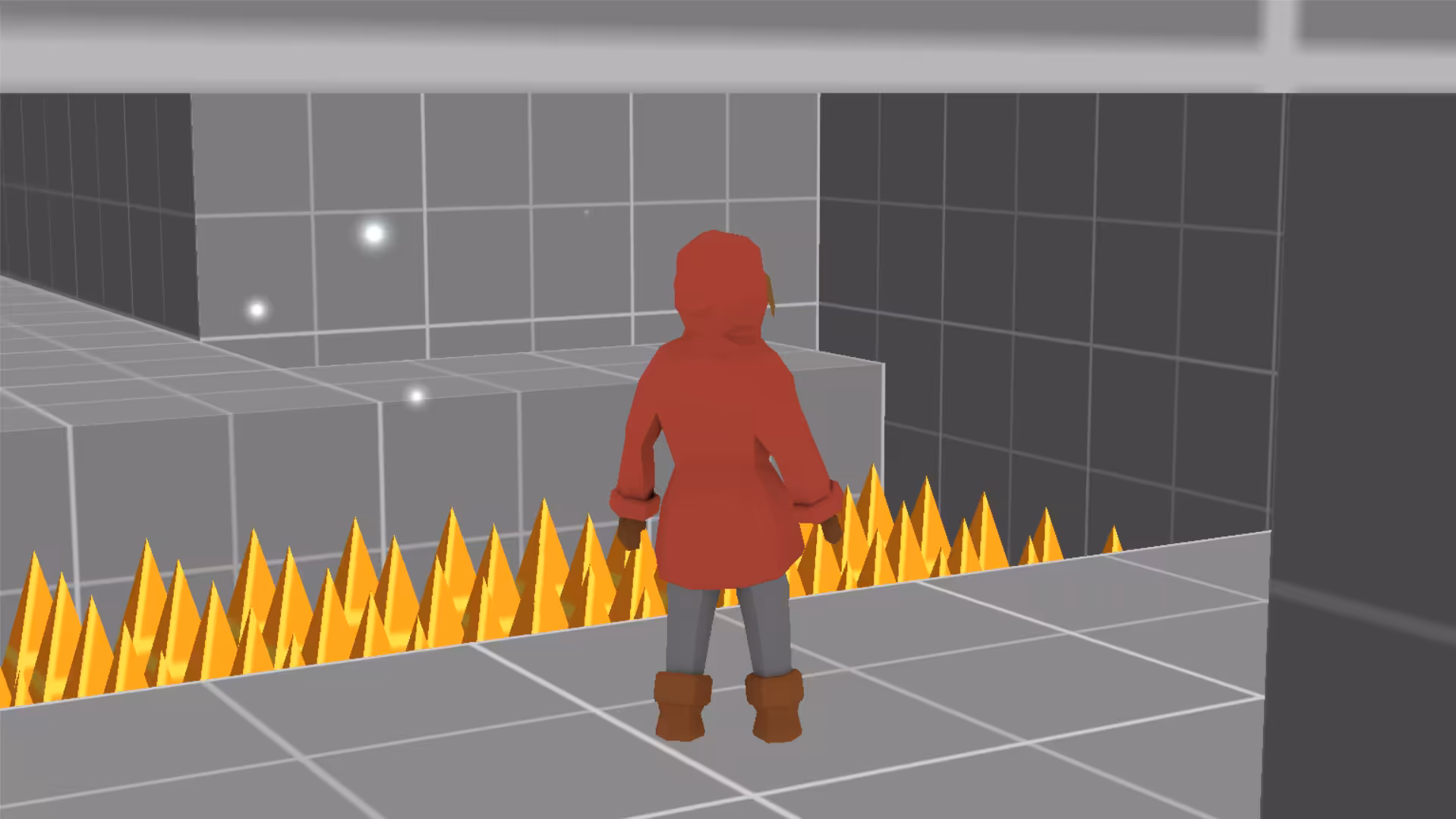 The player stands in front of a pit with spikes.